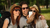 Three Tourists Taking Selfie