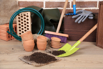 Tools of gardener on  bricks background