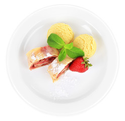 Tasty homemade strudel with ice-cream, fresh strawberry and