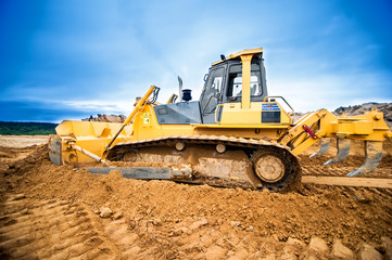 Excavator working and moving earth in construction site © aboutmomentsimages