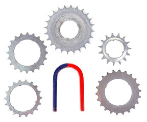 Magnet and metal gears isolated on white