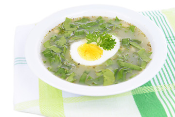 Delicious green soup with sorrel on table close-up