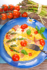 frittata with green asparagus,ham and cherry tomato