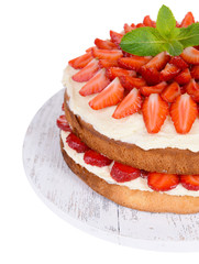 Delicious biscuit cake with strawberries isolated on white