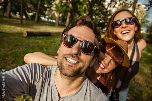 Three Young People Taking Selfie