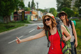 Two Tourist Girls Hitchhiking