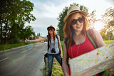 Two Tourist Girl Hitchhiking