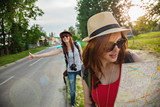 Two Tourist Girl Hitchhiking