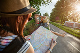 Two Tourist Girl Hitchhiking