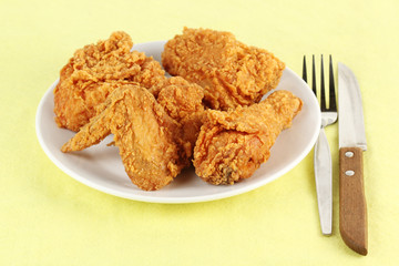 Fresh fried chicken on a white plate