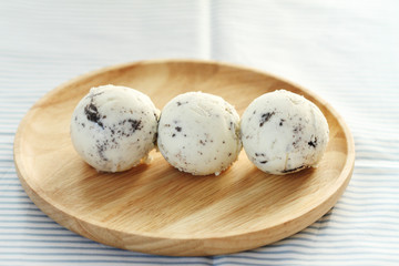 ice cream scoops on wooden plate