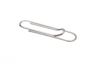 Metal paperclip on white background