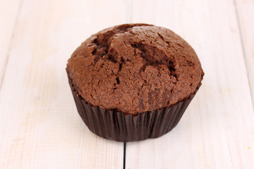 Fresh muffin on wooden background