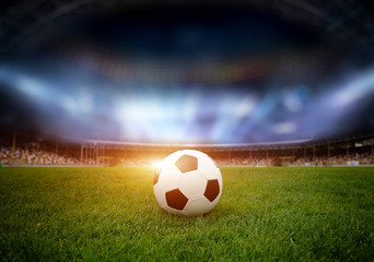 Soccer ball on the field of stadium