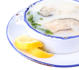 Tasty soup with oysters, isolated on white