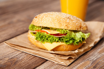 Delicious hamburger on a wooden table