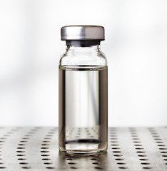 Medical vial of liquid in laboratory
