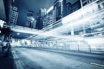 Tuinposter traffic with blur light through city at night © snvv