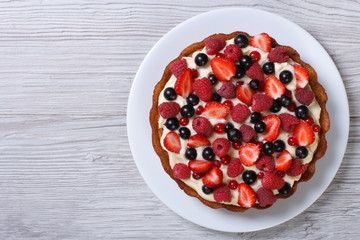 tart with fresh strawberries, raspberries and currants