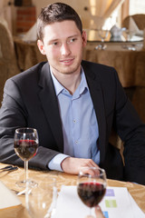Man drinking wine in a restaurant