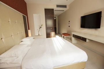 Fototapeta na wymiar Interior of a hotel bedroom in the morning 