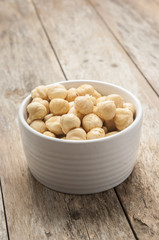 Hazelnuts close up on white bowl