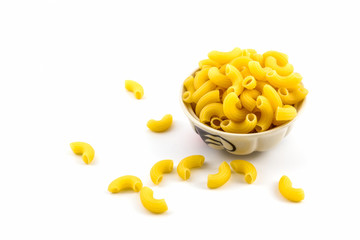 Raw macaroni in bowl.