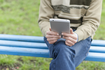 Man with tablet computer in hands.