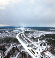 Highway and railway in the winter, top view