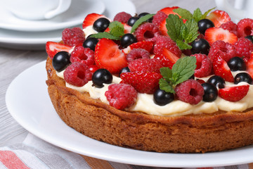 delicious berry tart with strawberries, raspberries, mint