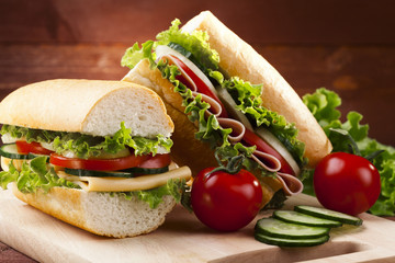 big sandwich with ham, cheese and vegetables