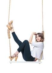 Beautiful girl swinging on swing. Isolated