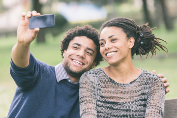 Mixed-Race Couple Taking Selfie