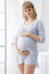 Portrait of the young pregnant woman