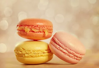 Türaufkleber French macarons on a wooden background with retro filter effect © g215