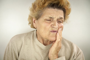 Senior woman having teeth ache - obrazy, fototapety, plakaty