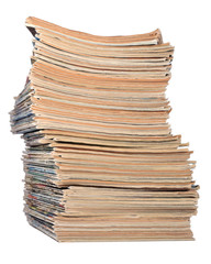 Stack of old magazines on a white