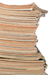 Stack of old magazines on a white