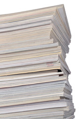 Stack of old magazines on a white