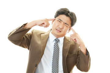 頭痛を訴えるビジネスマン