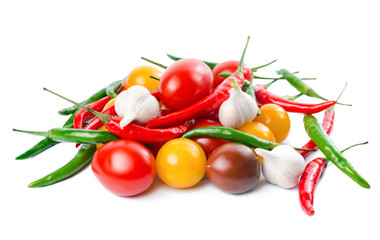 Fresh ripe red, yellow, black cherry tomatoes, garlic  and green