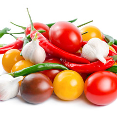Fresh ripe red, yellow, black cherry tomatoes, garlic  and green