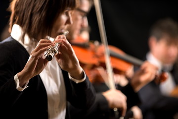Female flutist performing