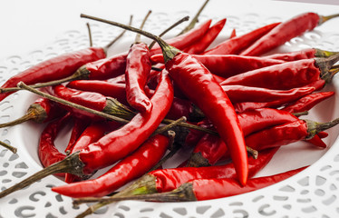 red peppers on decorated white tray