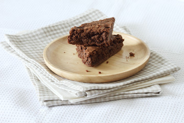 pile of brownie on a wooden plate