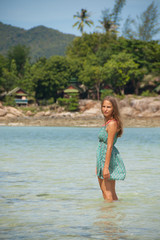Fototapeta premium woman standing knee-deep in water