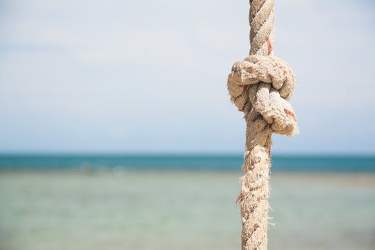 Knot On The Rope And Sea