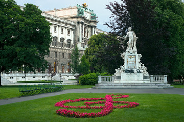 statue of Mozart and Hofburg palace in Vienna, Austria