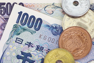 close - up japanese currency yen bank note and coin