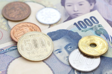 close - up japanese currency yen bank note and coin